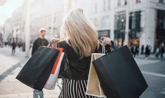 Woman carrying multiple shopping bags