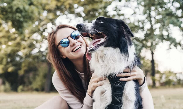 Woman playing with her dog