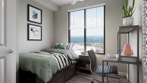 Furnished bedroom with large window