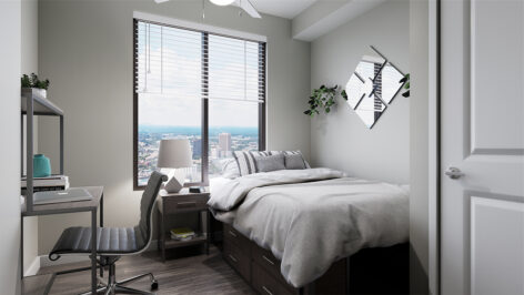 Furnished bedroom with large window