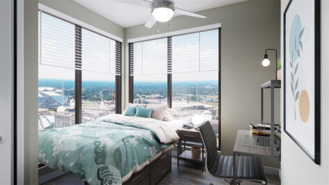 Furnished bedroom with large window